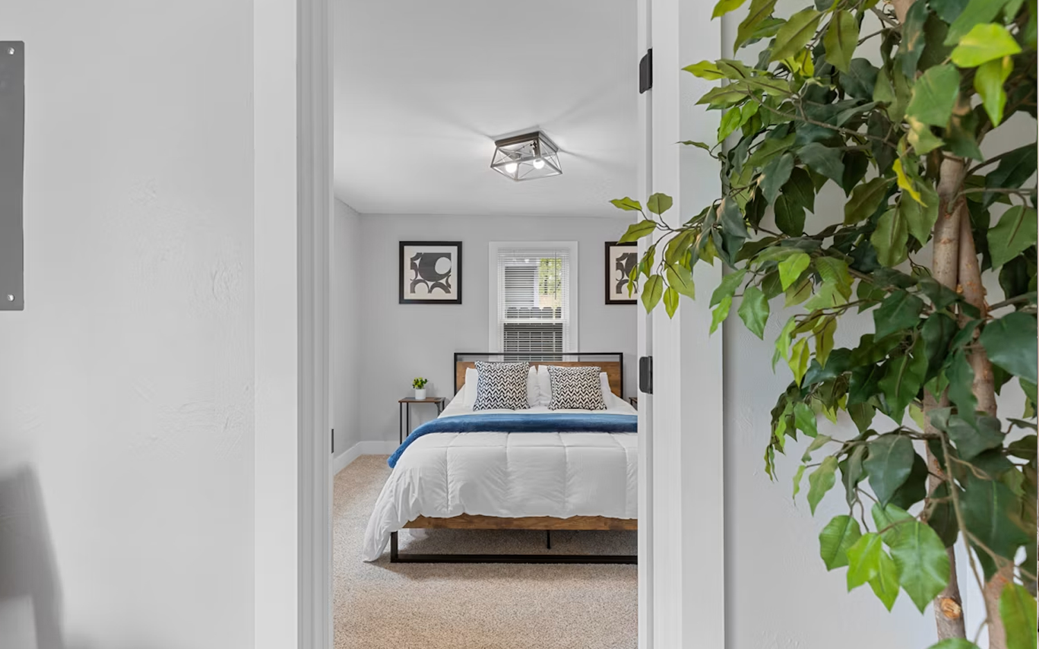 Premium short-let bedroom with white linen