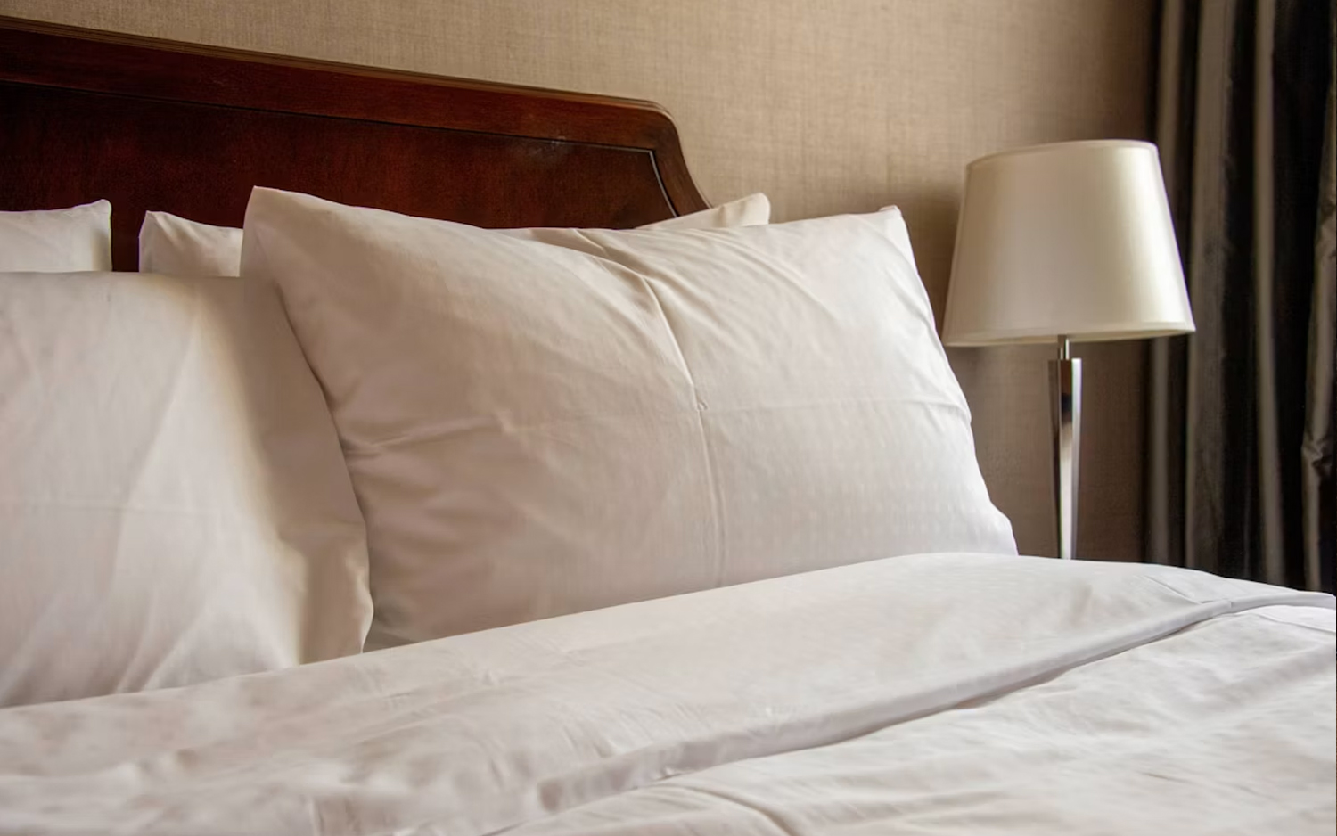 Premium short-let bedroom with white linen